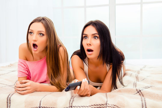 Scared Pretty Girls Watching Horror Film With Popcorn