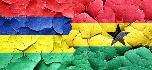 Mauritius flag with Ghana flag on a grunge cracked wall