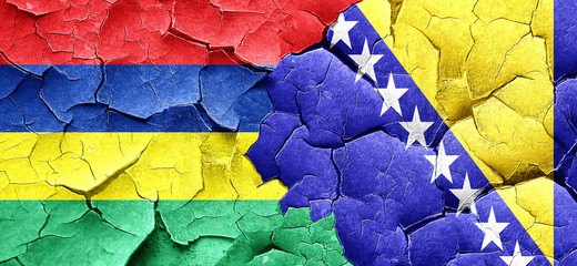 Mauritius flag with Bosnia and Herzegovina flag on a grunge crac