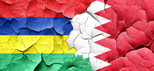 Mauritius flag with Bahrain flag on a grunge cracked wall