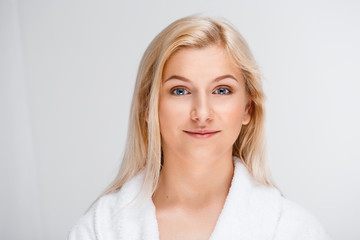 Obraz premium Portrait of young pretty girl over white background.