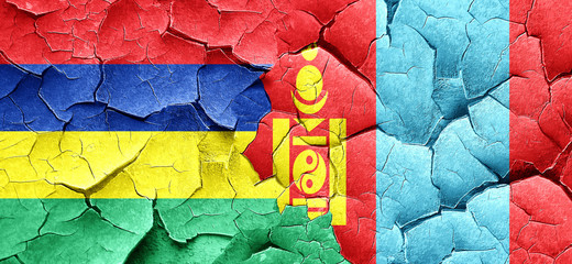 Mauritius flag with Mongolia flag on a grunge cracked wall