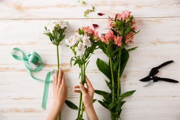 Flowers over wood background. From above. 
