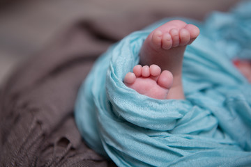 The feet of a newborn baby