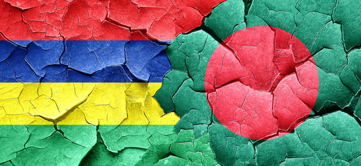 Mauritius flag with Bangladesh flag on a grunge cracked wall