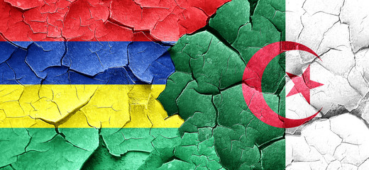 Mauritius flag with Algeria flag on a grunge cracked wall