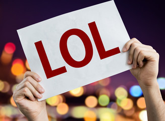 LOL placard with night lights on background