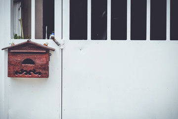Post box at white fence retro dark tone 