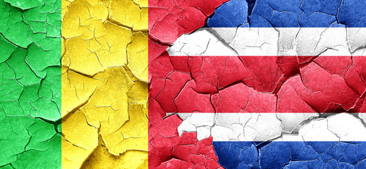 Mali flag with Costa Rica flag on a grunge cracked wall