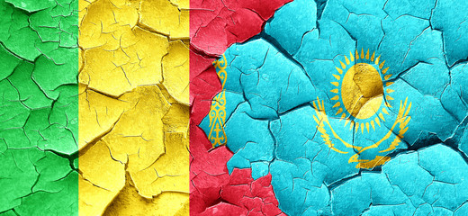 Mali flag with Kazakhstan flag on a grunge cracked wall