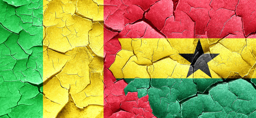 Mali flag with Ghana flag on a grunge cracked wall