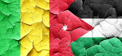 Mali flag with Jordan flag on a grunge cracked wall