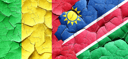 Mali flag with Namibia flag on a grunge cracked wall