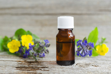 Obraz na płótnie Canvas Small bottle of natural cosmetic (essential) aroma oil