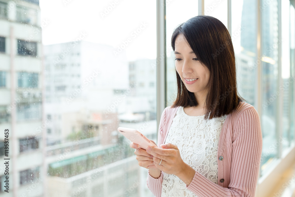 Canvas Prints Woman sending sms on cellphone