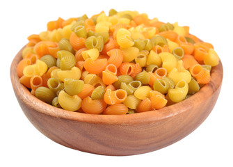 Colored uncooked italian pasta pipe rigate in a wooden bowl on a