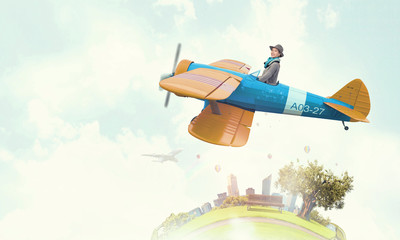 Girl flying old plane