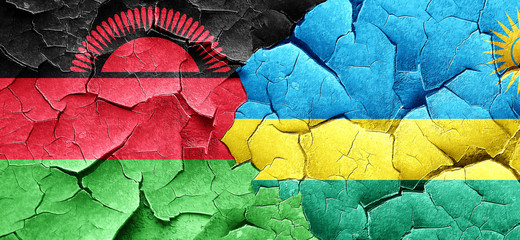 Malawi flag with rwanda flag on a grunge cracked wall