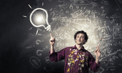 Man artist painting with brush