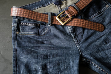 Blue jeans with leather belt