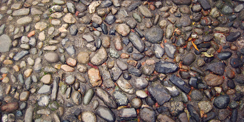 Paved Stone Walkway. Aged photo. Wet street paving stone. Cobblestone street. Old pavement useful as a background, Varenna, Lake Como, Italy.