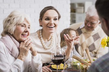Family talking and enjoying dinner
