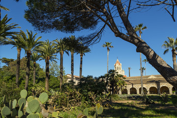 Obraz premium Christianity monastery with garden with palm trees