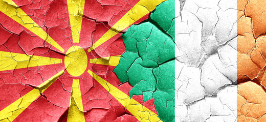 Macedonia flag with Ireland flag on a grunge cracked wall