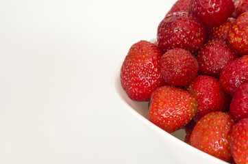 Ripe strawberry with copy space. Summer berries isolated on white background.