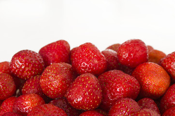 Ripe strawberry with copy space. Summer berries isolated on white background.