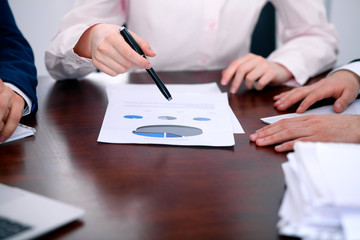 Group of business people at meeting  discussing financial results