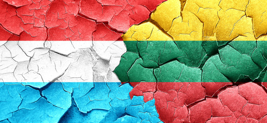 Luxembourg flag with Lithuania flag on a grunge cracked wall