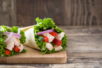 Mexican fajitas on wooden table

