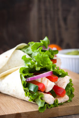 Mexican fajitas on wooden table

