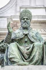 An image of a statue of Pope Sixtus V in front of the Basilica della Santa Casa in Italy Marche