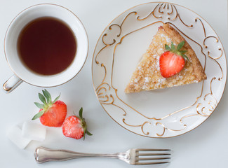 Handmade pie with strawberries and tea