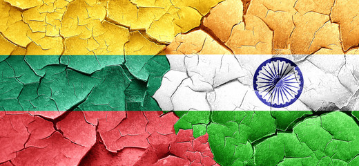 Lithuania flag with India flag on a grunge cracked wall