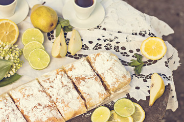pie, strudel with pear and lemon. Cup of coffee. .Picnic, Breakfast in nature. Food in nature.