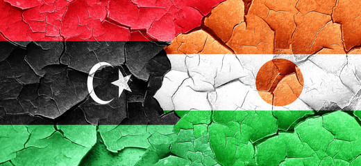 Libya flag with Niger flag on a grunge cracked wall