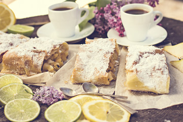 pie, strudel with pear and lemon. Cup of coffee. .Picnic, Breakfast in nature. Food in nature.