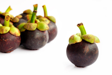 Mangosteens on white background.