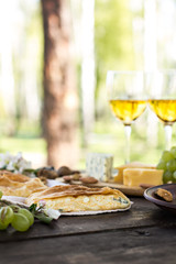 Сheese pie, strudel with cheese, cheese pie 4. Wine, grapes, nuts, cheese, blue cheese, and coffee. dinner, lunch, romantic date, picnic, eating on nature.