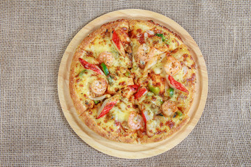 Seafood pizza on sackcloth