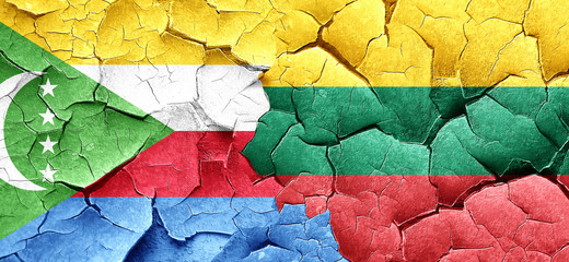 Comoros flag with Lithuania flag on a grunge cracked wall