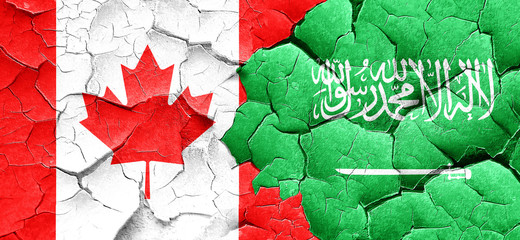 Canada flag with Saudi Arabia flag on a grunge cracked wall