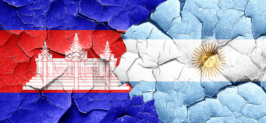 Cambodia flag with Argentine flag on a grunge cracked wall