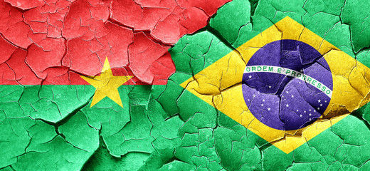 Burkina Faso flag with Brazil flag on a grunge cracked wall