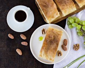 Сheese pie, strudel with cheese, cheese pie 4. Wine, grapes, nuts, cheese, blue cheese, and coffee. dinner, lunch, romantic date, picnic, eating on nature.