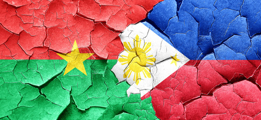 Burkina Faso flag with Philippines flag on a grunge cracked wall