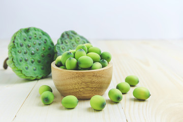 Lotus seed pod in wooden bowl